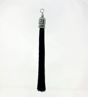 beaded modular tassel ith silver cap and black threads in white background by object and dawn