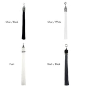 Four tassels in different colors with color names in text on a white background