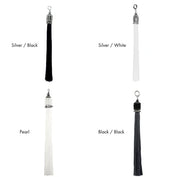 Four tassels in different colors with color names in text on a white background