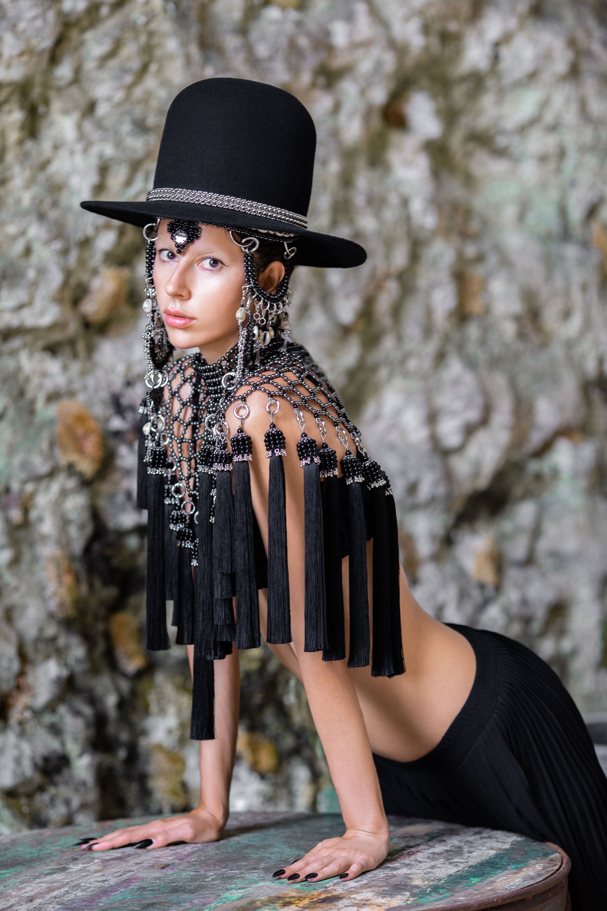 Beaded handcrafted polyester tassel by silver coated metal beads back crystal with freja cape and rushi headpiece on grey background