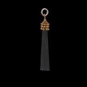 Beaded modular polyester tassel 22k gold wash polymer metal beads with black threads on black background