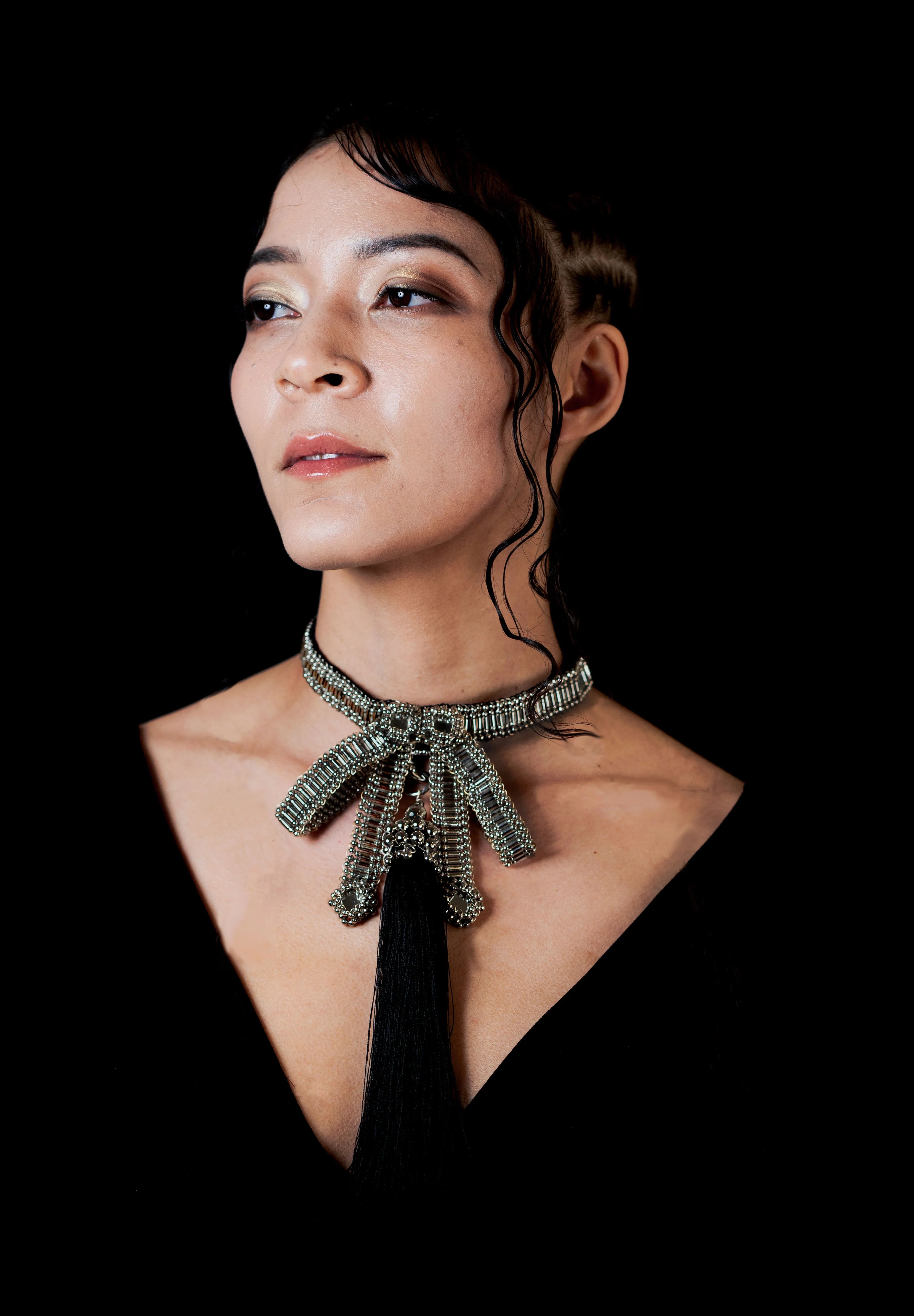 beaded bow modular choker silver by object and dawn worn by woman in black outfit
