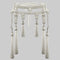 Decorative beaded belt made with synthetic pearls, and white thread tassels on a gray background
