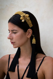 woman with Gold beaded Amaya Bow headband by Object & Dawn on a neutral background