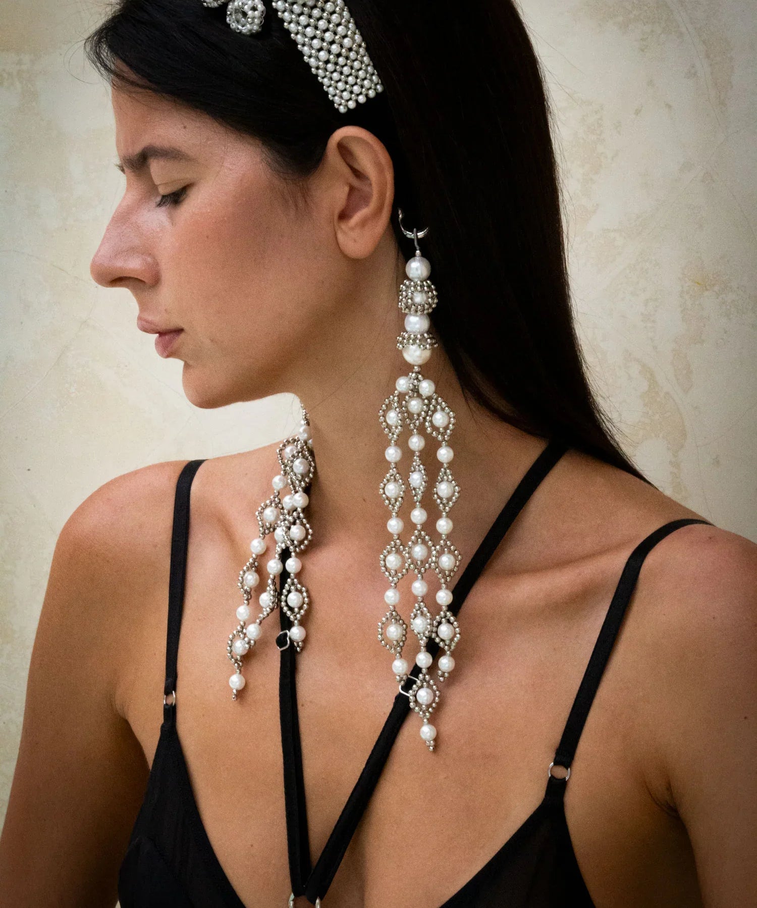 woman in black outfit wear handcrafted beaded modular headband with trinity medallion by object and dawn