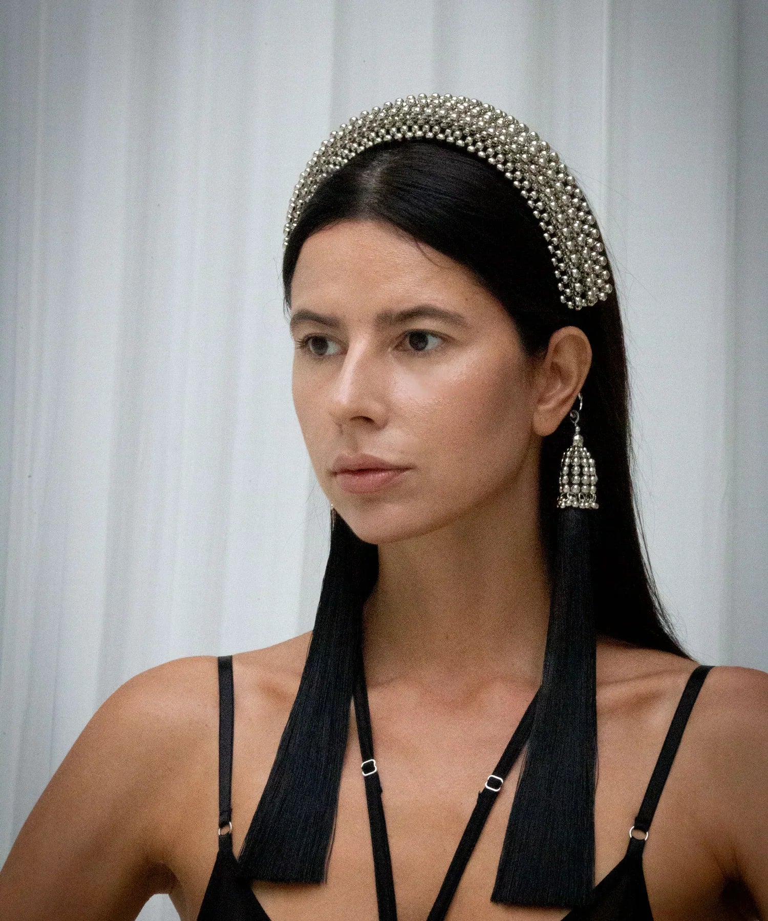 Object & Dawn Beaded Anais Modular Headband in silver wear by woman in grey back ground 