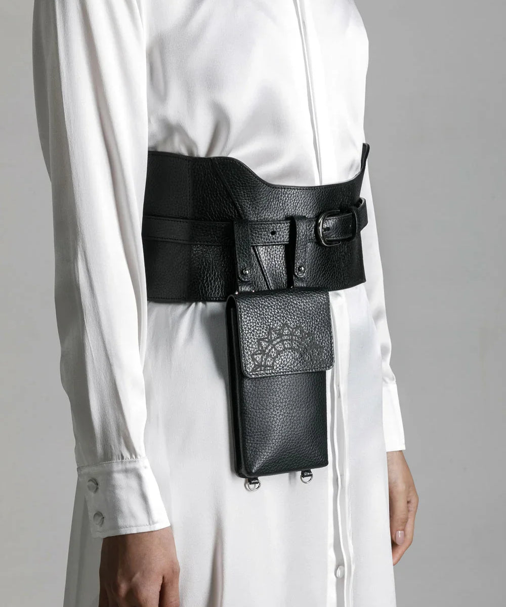 woman in white shirt dress wear zheng iphone bag and corset belt by object and dawn close up in netural background