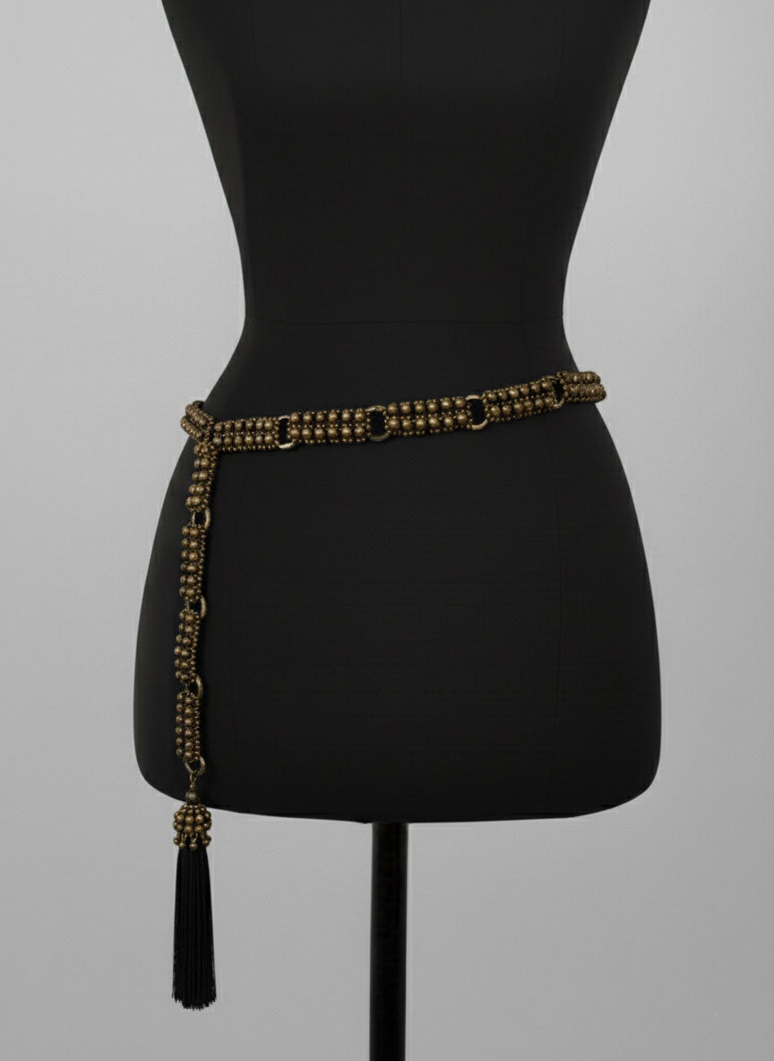 Beaded Adjustable Chain belt with tassels by Object & Dawn on a mannequin against a gray background