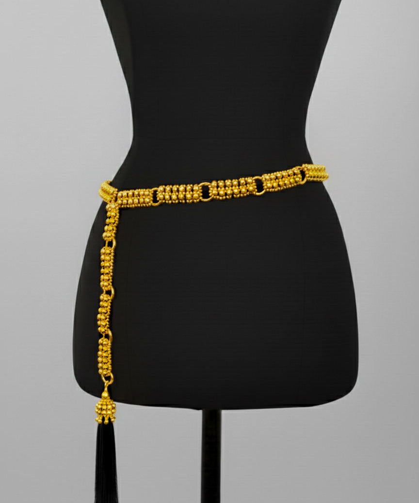 Beaded Adjustable Chain belt with tassels by Object & Dawn on a black mannequin against a gray background