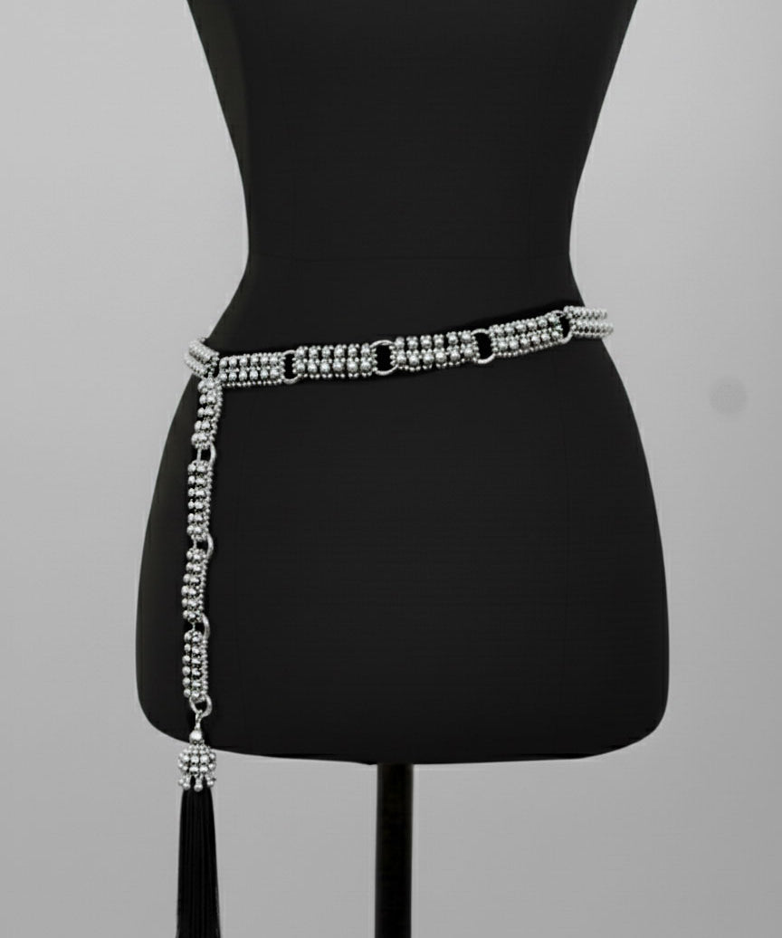 Beaded Adjustable Chain belt with tassels by Object & Dawn on a mannequin against a gray background