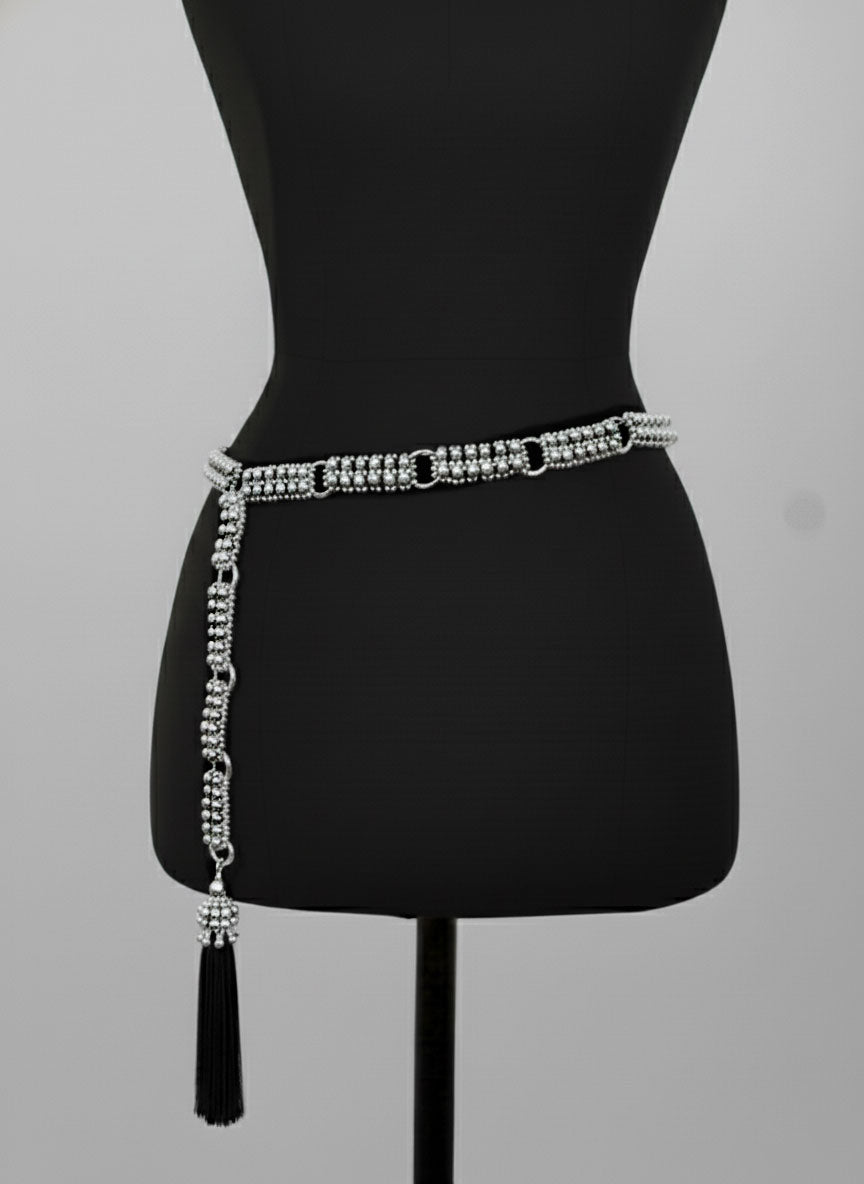 Beaded Adjustable Chain belt with tassels by Object & Dawn on a mannequin against a gray background
