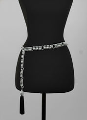 Beaded Adjustable Chain belt with tassels by Object & Dawn on a mannequin against a gray background