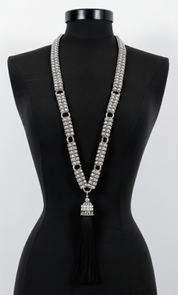 Beaded Link Neklace By Object & Dawn with tassel on a black mannequin against a white background
