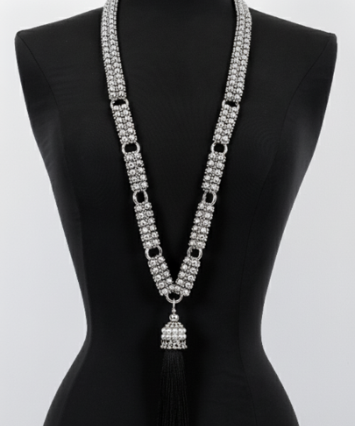 Beaded Link Neklace By Object & Dawn with tassel on a black mannequin against a white background