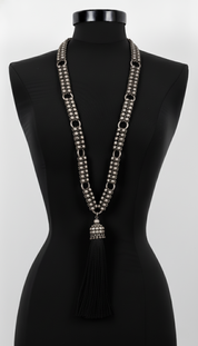 Beaded Link Neklace with tassel  By Object & Dawn on a black mannequin against a white background