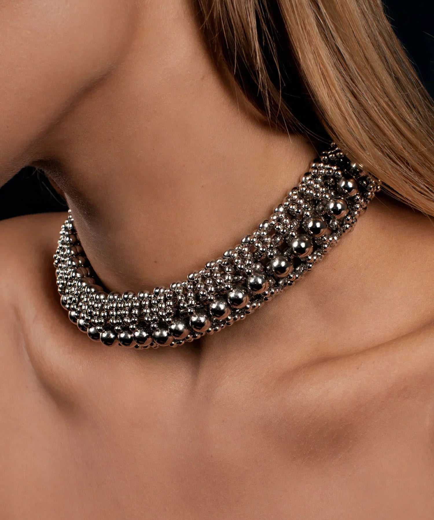 woman in black dress with beaded modularhelios optical 3d choker in silver by object & dawn