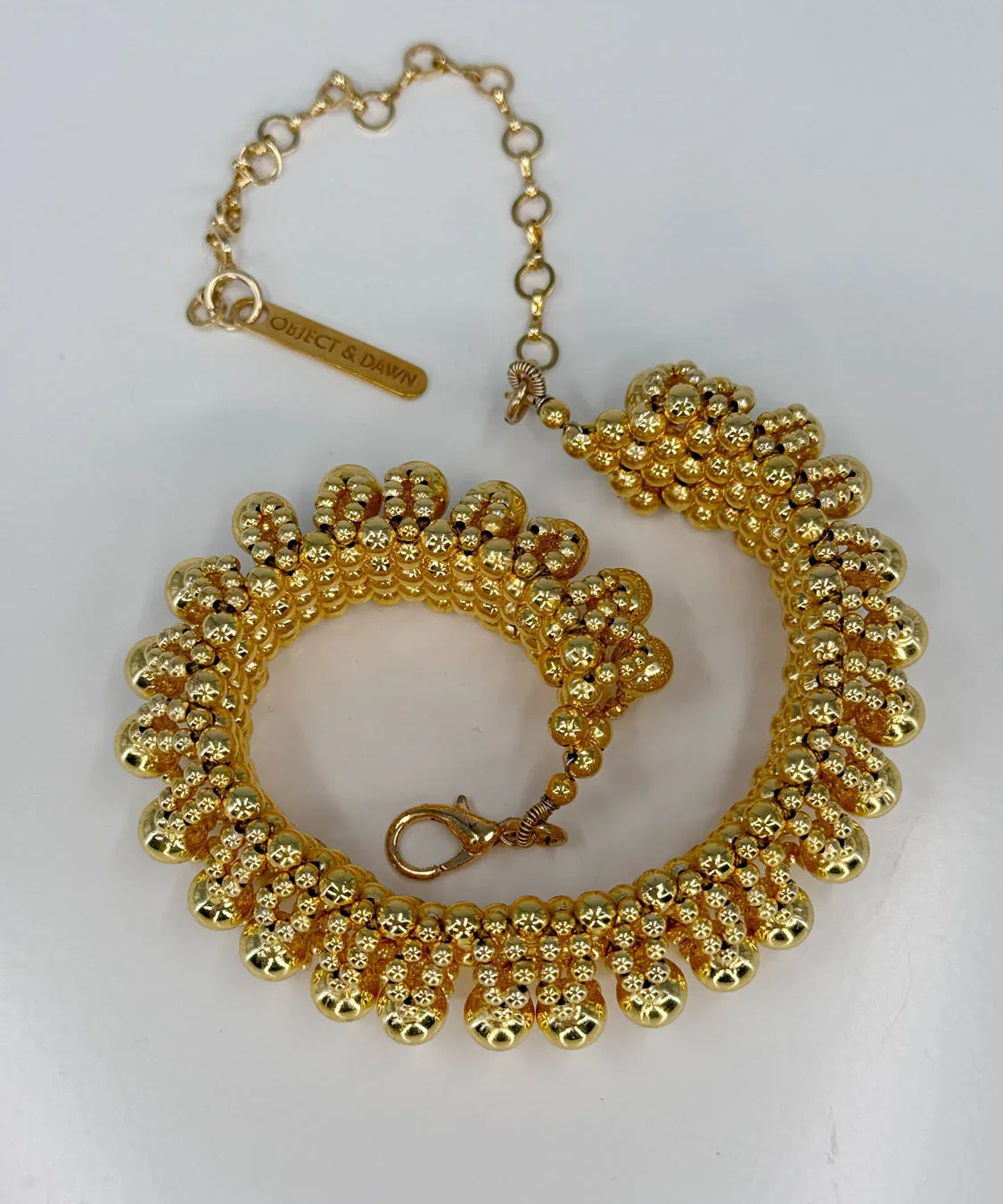 ghost image optical 3d choker in 22k gold wash by object & dawn in white background