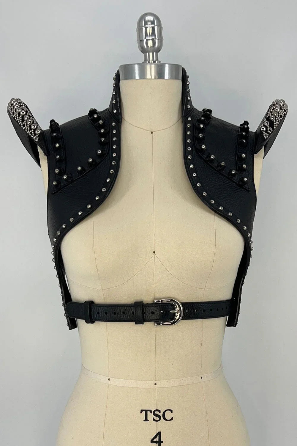 beaded premium leather helios bolero jacket by object and dawn in grey background front view