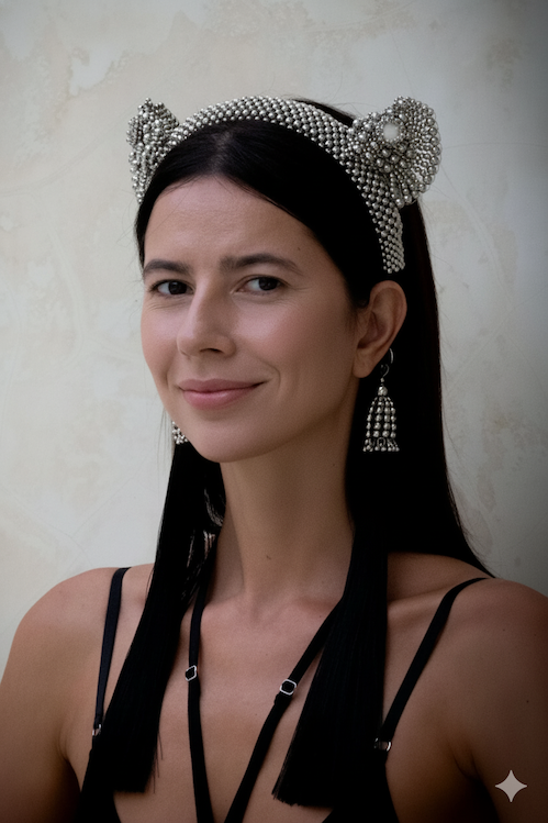 A woman with black long hair wearing Tamoe SIlk Harness Skirt and a jas headband in silver by Object&amp;Dawn