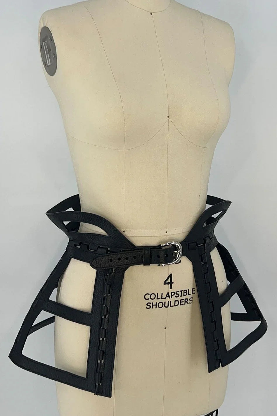 premium leather jas leather cage skirt black on mannequin in white background