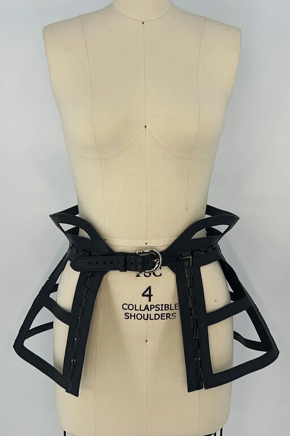premium leather jas leather cage skirt black on mannequin in white background