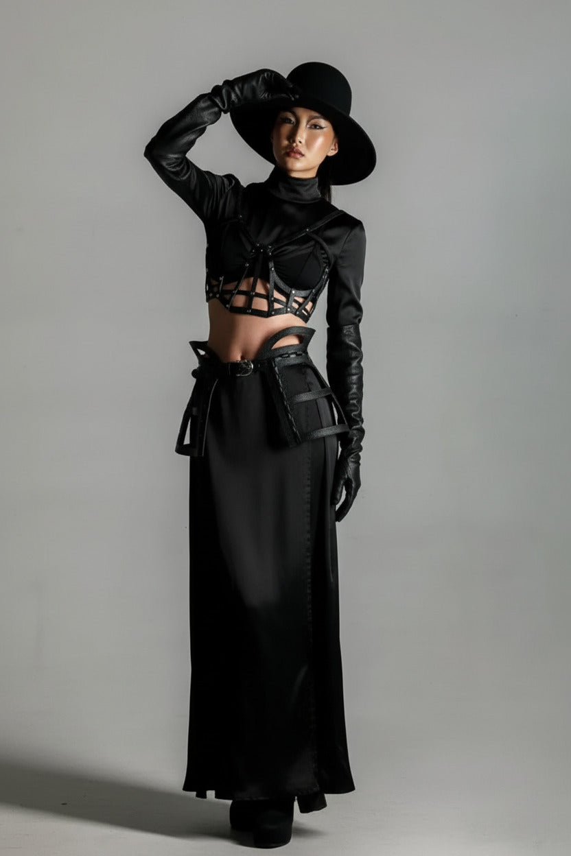woman with black outfit and modular jas leather cage skirt and top by object and dawn