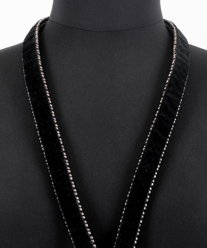 close-up of velvet lining with handcrafted beaded detail on luxury x beaded harness