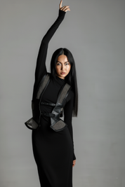 Woman wearing a black outfit with Lister Beaded Leather Girdle Belt Bodice by Object & Dawn on a gray background