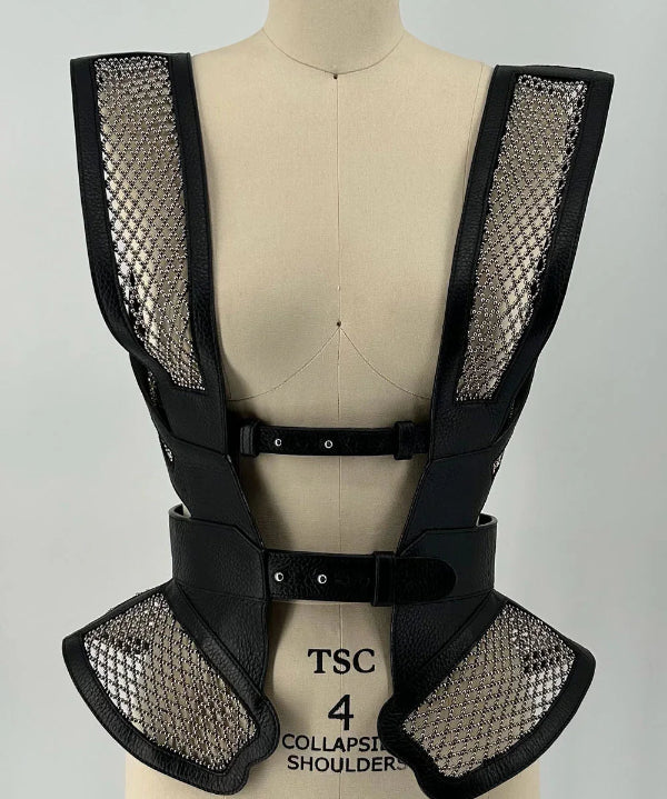 Black beaded mesh and leather top on a mannequin front