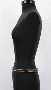 Black Mannequeen with Modular Beaded Belt by OBject & Dawn against a white background