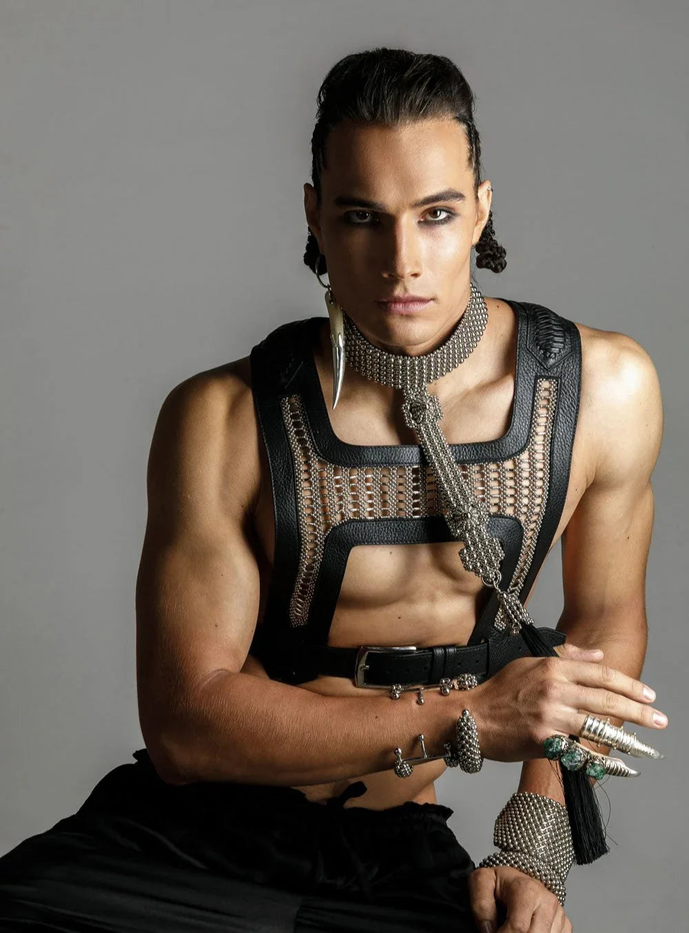 mens on grey background pose on sit position with modular beaded t-choker and yusuke beaded harness by object and dawn