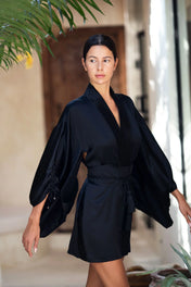 woman wear Mineko Short Silk Kimono with obi belt black posing against natural look background