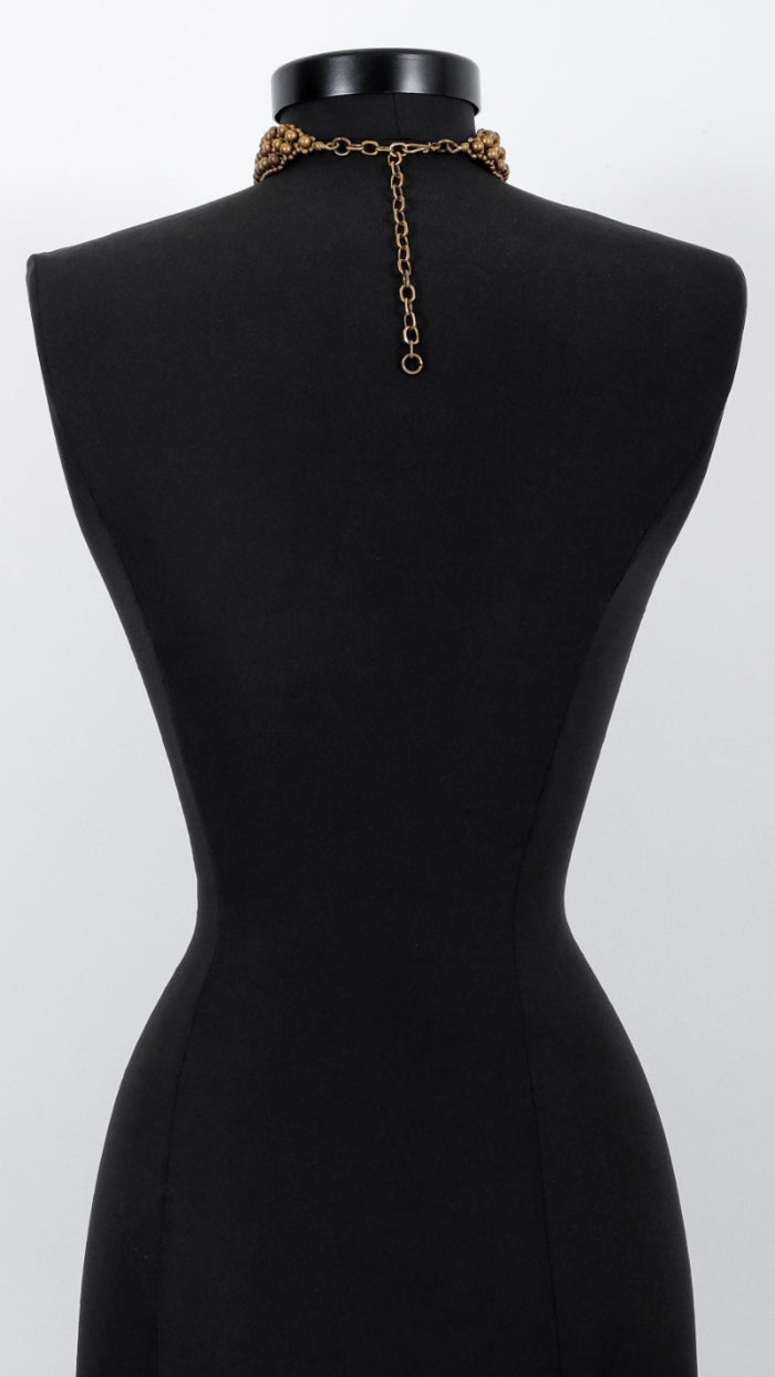 Signature Slim T-Choker Antq Gold on a black mannequin against a white background by Object & Dawn.