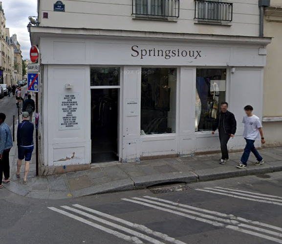 Storefront with 'Springsioux' branding on a city street.