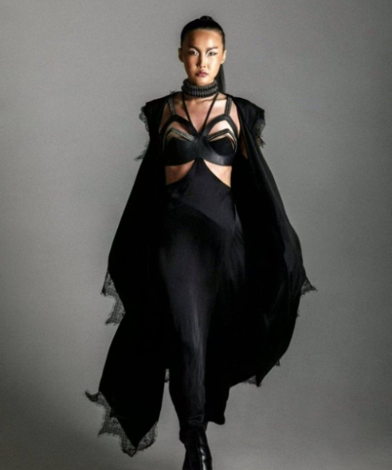 woman with harness skirt and teuta lace robe by object and dawn