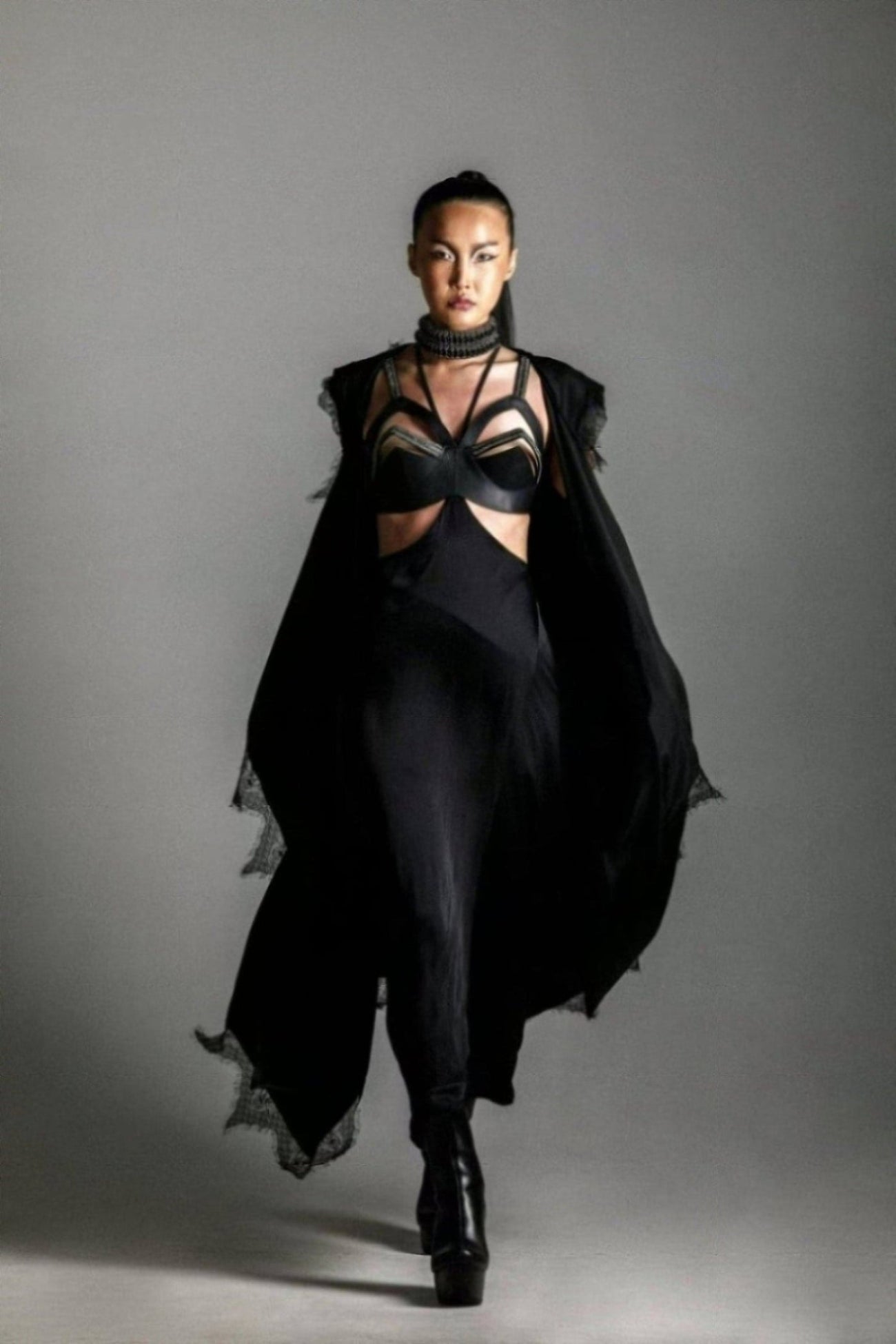 woman with harness skirt and teuta lace robe by object and dawn