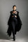 woman with harness skirt and teuta lace robe by object and dawn