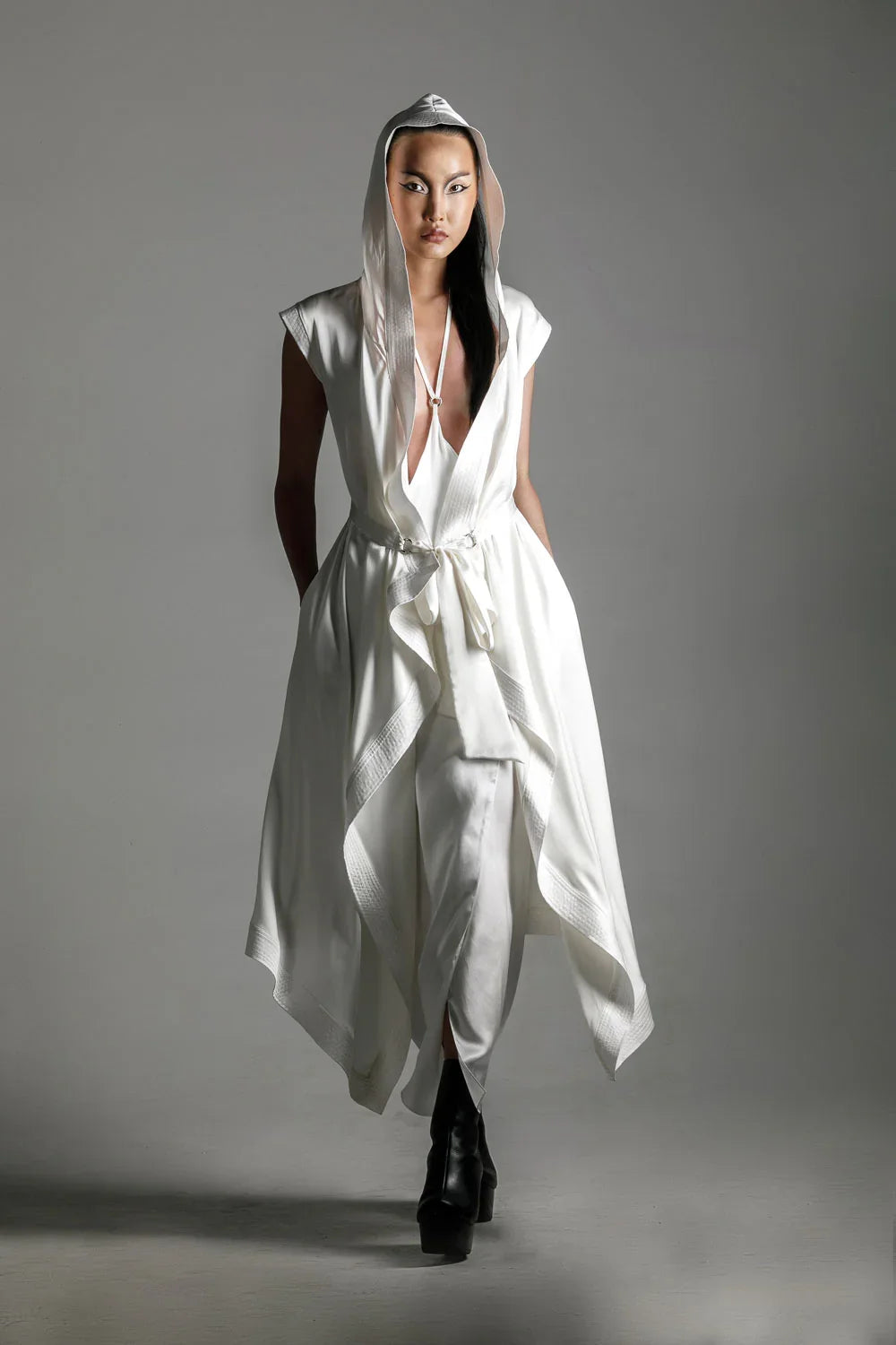 woman with luxury silk top stiched hooded cap and tamoe silk harness skirt in white by object and dawn