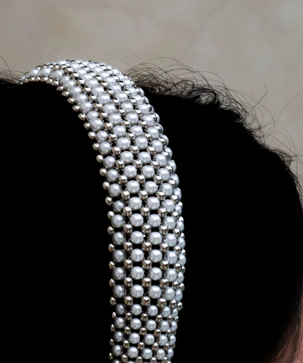 Object & Dawn Teuta Headband pearl detail view worn by woman in neutral background