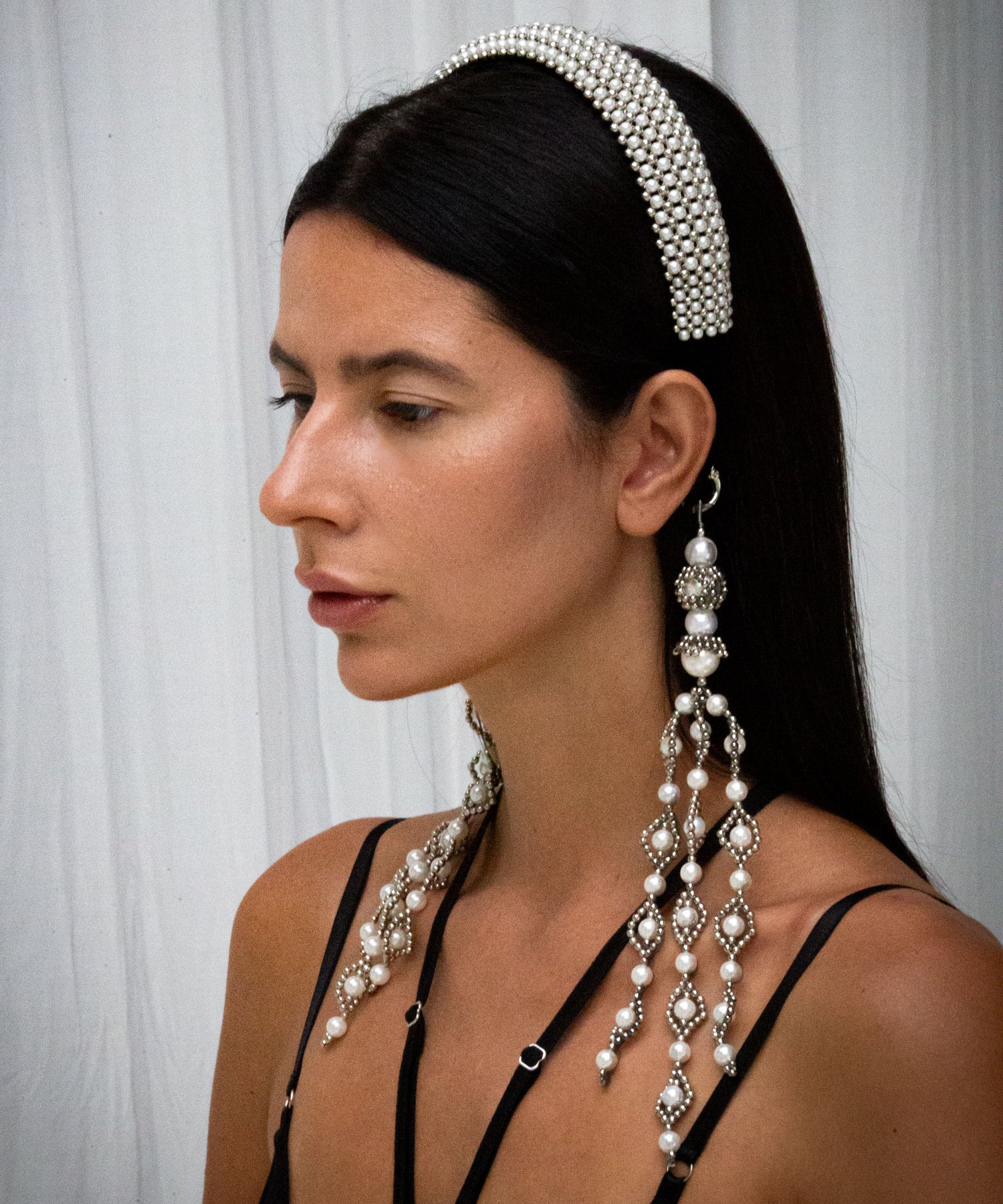 woman wear Teuta Headband pearl with trinity medallions in neutral background by object & dawn