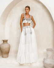 woman in white long skirt with modern bridal outfit