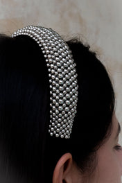 Silver beaded Teuta headband by Object & Dawn worn by a person with a neutral background