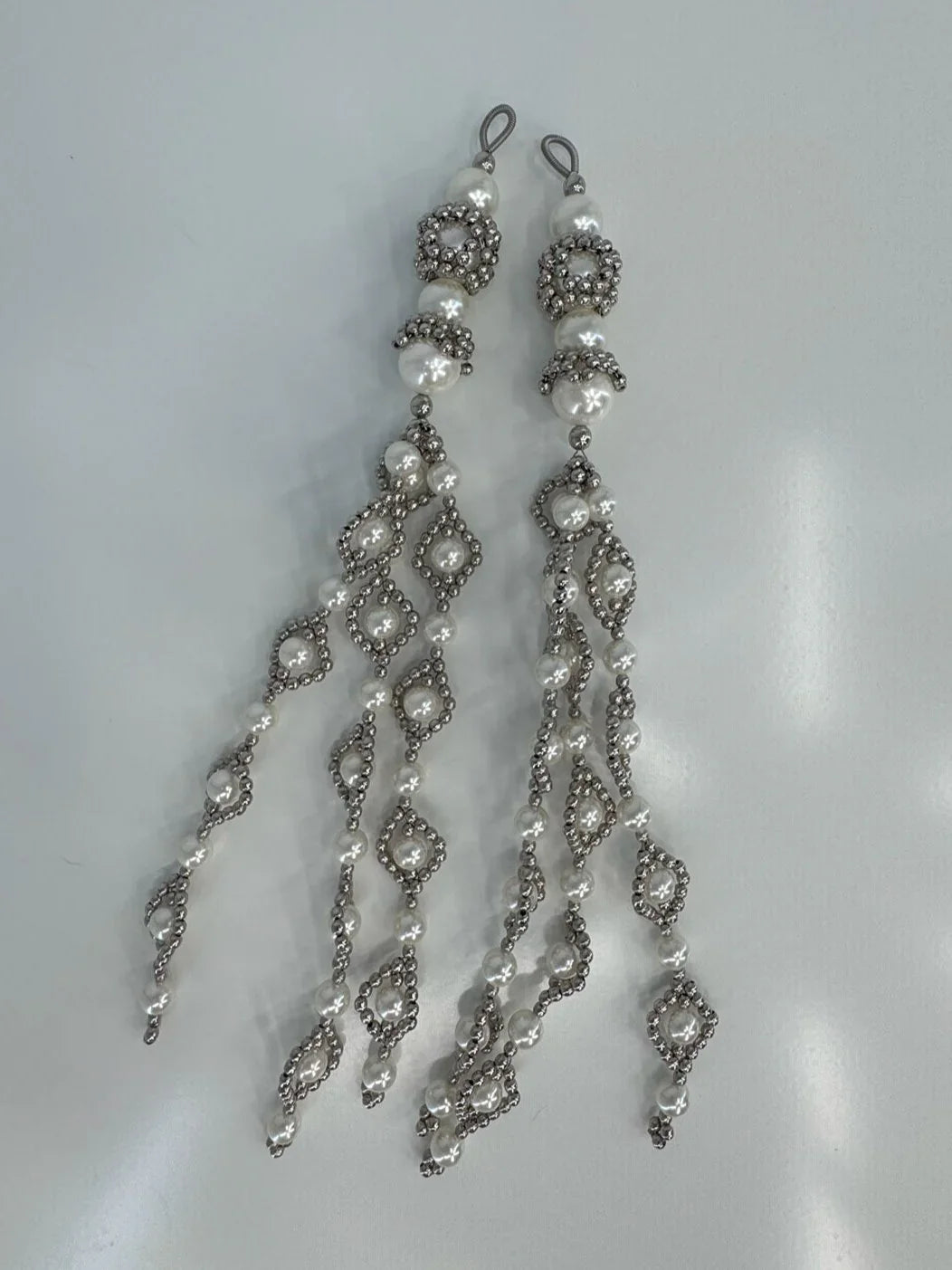ghost image handcrafted modular trinity medallions in pearl by object and dawn