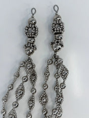 Beaded medallions from polymer metal beads by object and dawn on neutral background