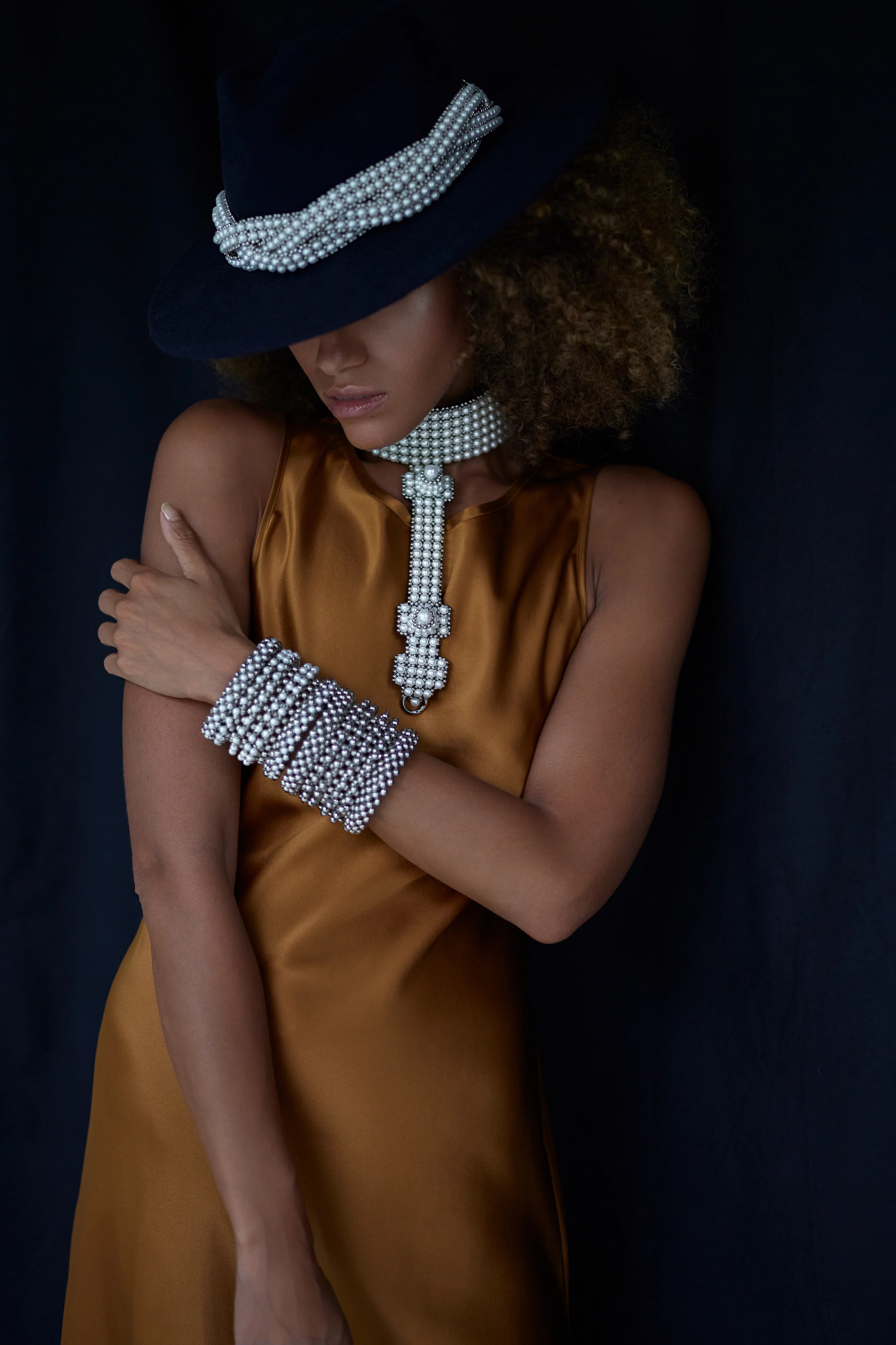 Beaded modular hat accessory from polymer metal beads and syntethis japananese pearl by object and dawn on neutral background