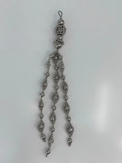 Beaded medallion from polymer metal beads by object and dawn on neutral background