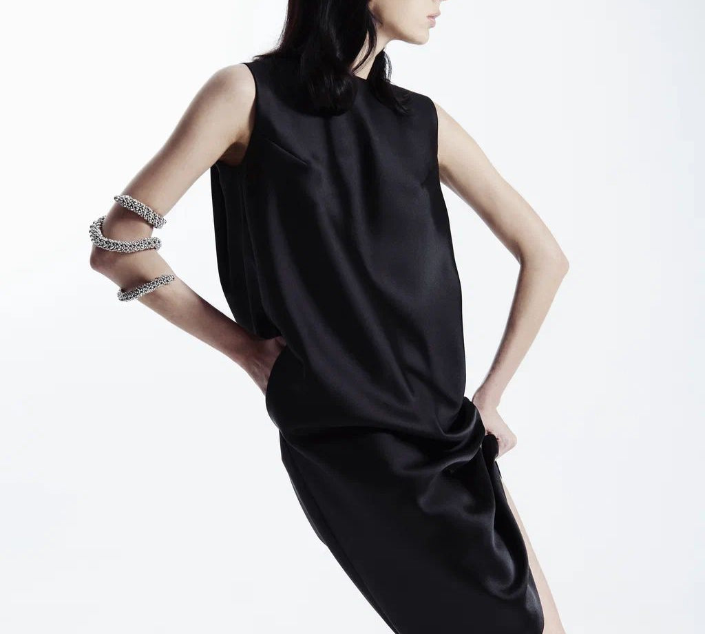Woman in black outfit wear Zetian Beaded Spiral Cuff silver by Object&Dawn