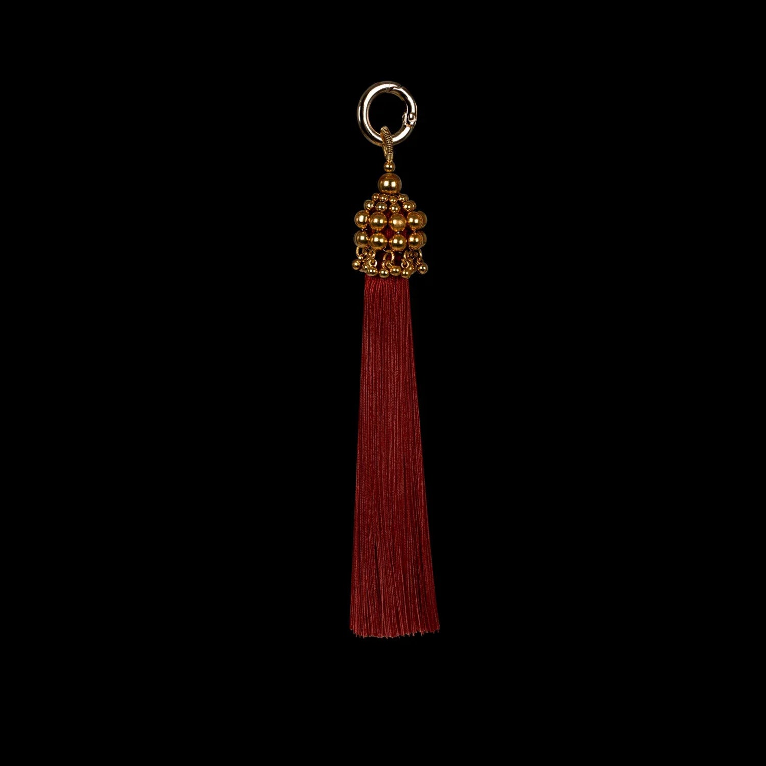 beaded polyester tassel in gold and burgundy threads by object and dawn