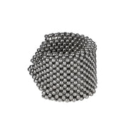 Object & Dawn beaded wrist accessory in ivory, structured supple cuff with polymer metal beads, ghost image side view