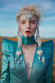blond woman wearing Rushi Modular Headpiece System by Object & Dawn. A silver beaded crown with side panels that hang to the woman's chest.